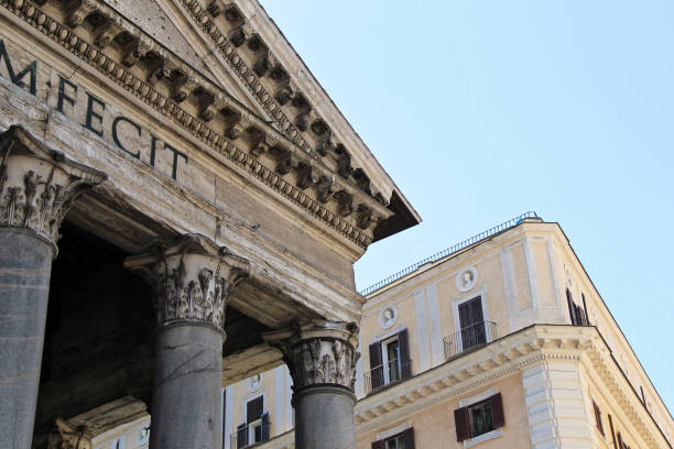 Captivating view of historic architectural buildings along Via del Corso in Rome, Italy. The photo emphasizes the beauty and details of traditional Roman architecture, featuring distinctive windows, facades, and rooftops beneath a moody, cloudy sky. Perfect for conveying the atmosphere of classic Roman urban scenes and historical European streets.