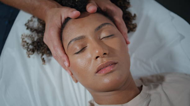 istock Osteopath patient lying couch with closed eyes top view. Relaxed woman visiting 2155345725