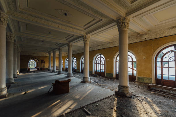istock Large hall with columns in old abandoned mansion 2155345765