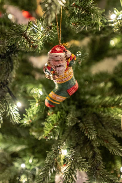 istock Christmas ornaments hanging from a christmas tree.. 2155347849