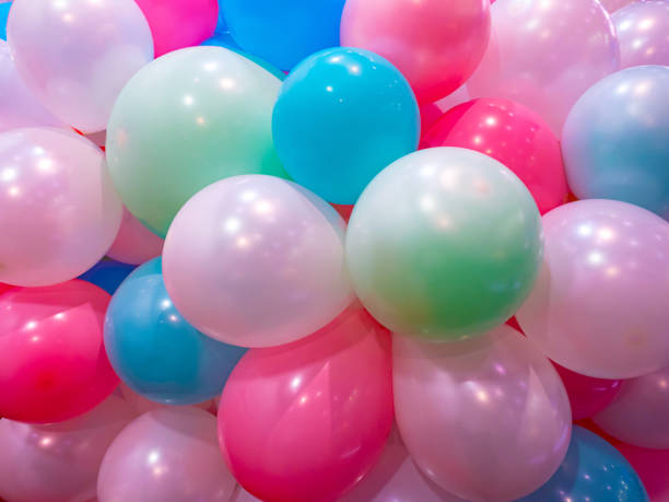 istock Background. Multi-colored balloons.Background of balloons. Background for childrens image. Children's holiday.Decoration by air globs. Organization of holidays. Helium globs.Selling helium balloons 2155348717