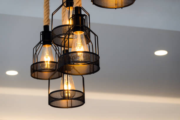 istock Vintage lamp hanging from the ceiling with white wall decorated in hotel 2155349549