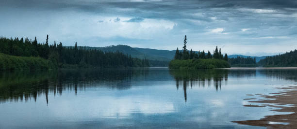 istock Tranquil Reflections: A Majestic Mountain and Serene reviere 2155351587