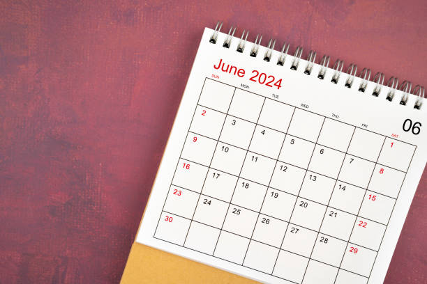 istock June 2024 desk calendar on red background. 2155351835