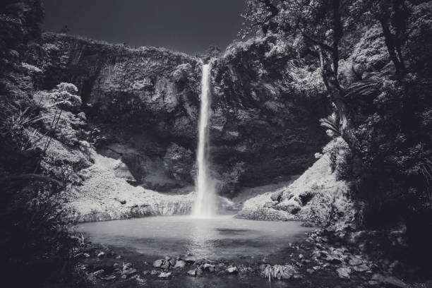 A waterfall with a black and white filter