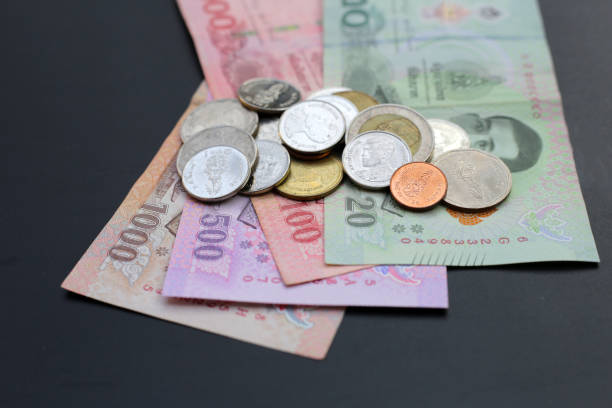 istock Banknotes with coins of the Thai baht 2155354832