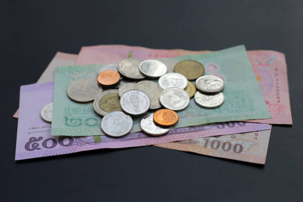 istock Banknotes with coins of the Thai baht 2155354833