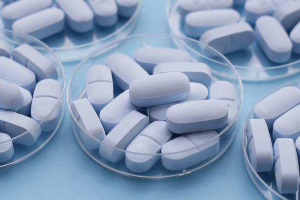 istock PrEP ( Pre-Exposure Prophylaxis) used to help protect people from HIV, blue background. 2155356069