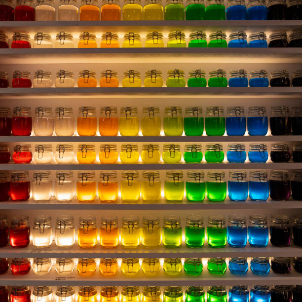 A shelf with colorful water bottles displayed on it.