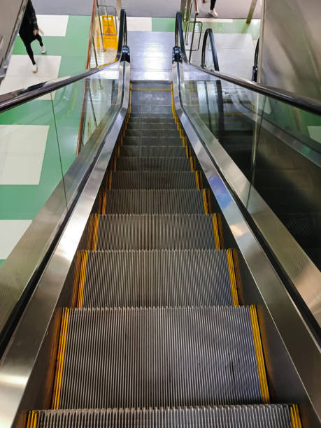 istock Escalator stairs inside the office building for ascent and descent 2155357661