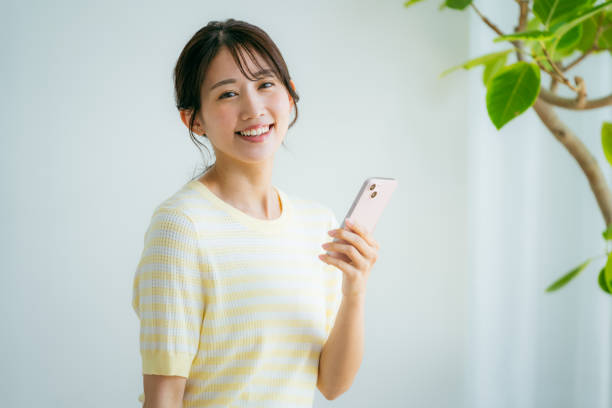 istock young woman calling on smartphone 2155360307