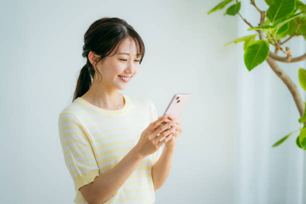 istock young woman calling on smartphone 2155360308