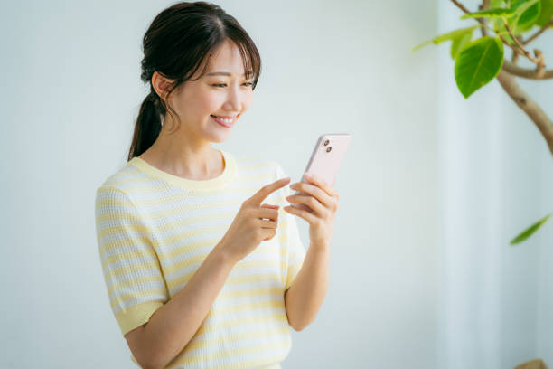 istock young woman calling on smartphone 2155360323