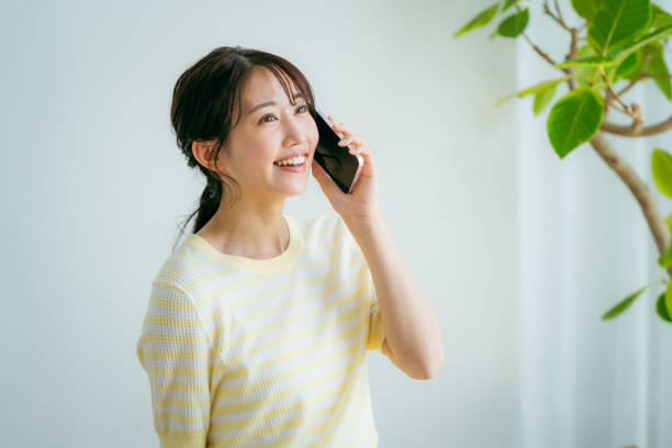 istock young woman calling on smartphone 2155360341