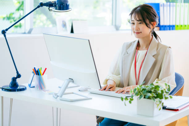 istock business woman working in the office 2155360409