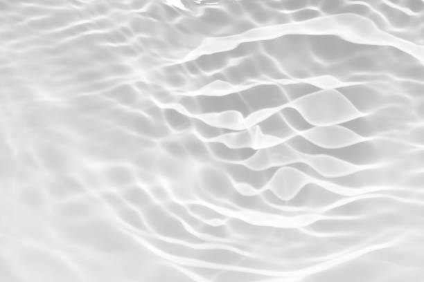 istock Blue water with ripples on the surface. Defocus blurred transparent blue colored clear calm water surface texture with splashes and bubbles. Water waves with shining pattern texture background. 2155363109