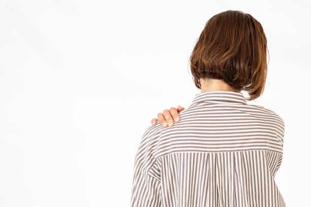 istock A woman suffering from stiff shoulders. 2155363200