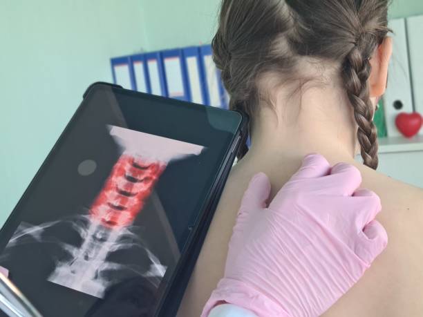 istock A Doctor Examining a Childs Neck X-ray During a Medical Checkup 2155369958