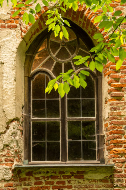 istock Antique wooden window in historic brick building. 2155372494