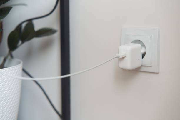 istock The telephone socket is plugged into the socket. Charge your phone, tablet. 2155375083
