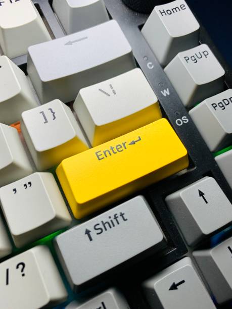 istock A close up of mechanical keyboard enter button with light grey, grey, yellow color keycaps 2155375751