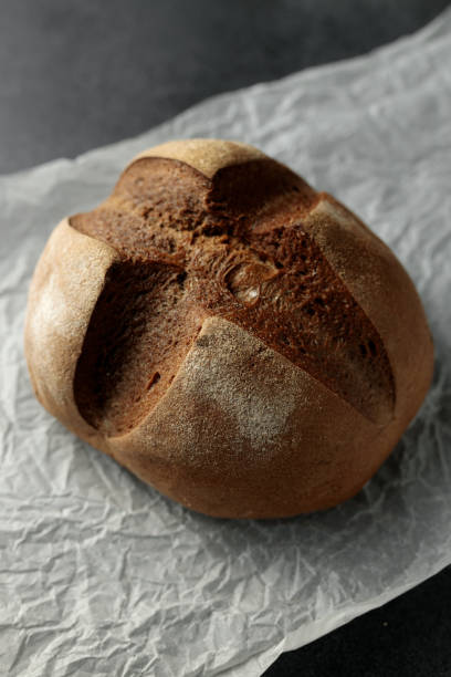 istock beautiful homemade raisin bread on parchment 2155375936