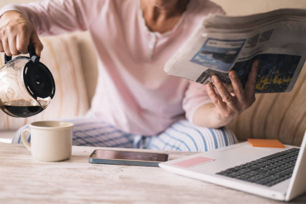 istock Relaxed Person In Pajamas Morning Pouring Coffee. 2155376193