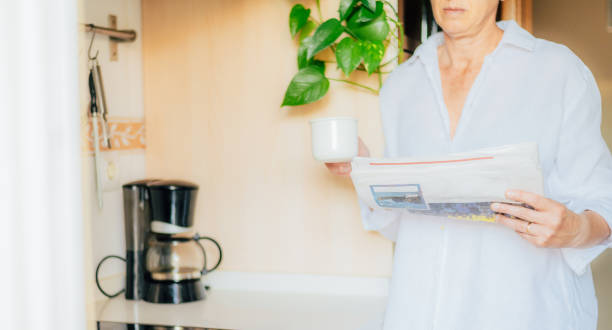 istock Woman Preparing A Cup Of Coffee In The Kitchen. 2155376224