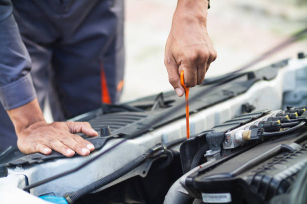 istock car service center mechanics are checking condition car and engine make sure they are ready use and in perfect condition according center warranty. periodic vehicle inspections for safety in driving. 2155379864