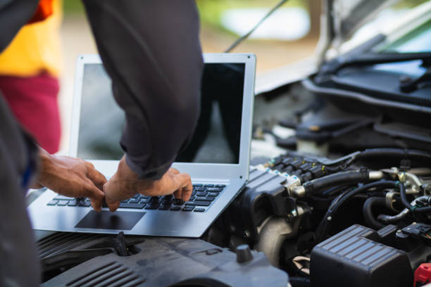 istock car service center mechanics are checking condition car and engine make sure they are ready use and in perfect condition according center warranty. periodic vehicle inspections for safety in driving. 2155380040