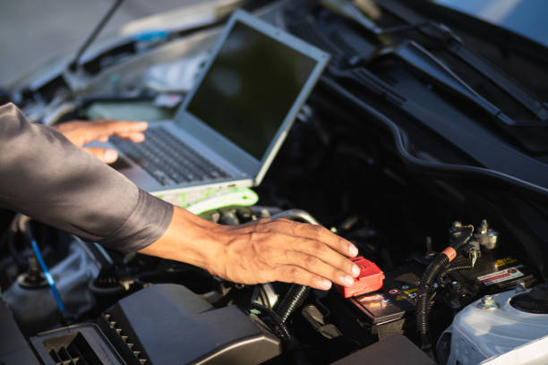 istock car service center mechanics are checking condition car and engine make sure they are ready use and in perfect condition according center warranty. periodic vehicle inspections for safety in driving. 2155380262