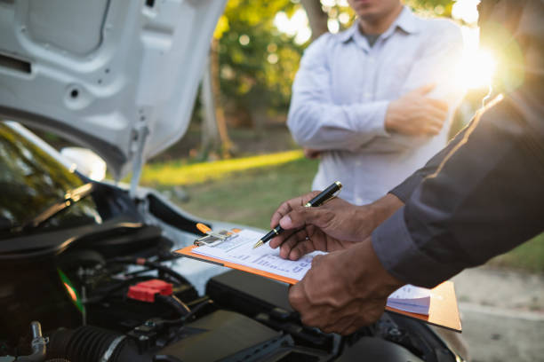 istock car service center mechanics are checking condition car and engine make sure they are ready use and in perfect condition according center warranty. periodic vehicle inspections for safety in driving. 2155380537