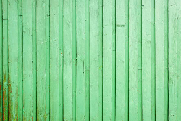 istock Old light green painted wooden wall close up 2155381049