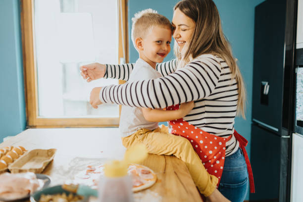 istock Happy family making dinner together 2155383657