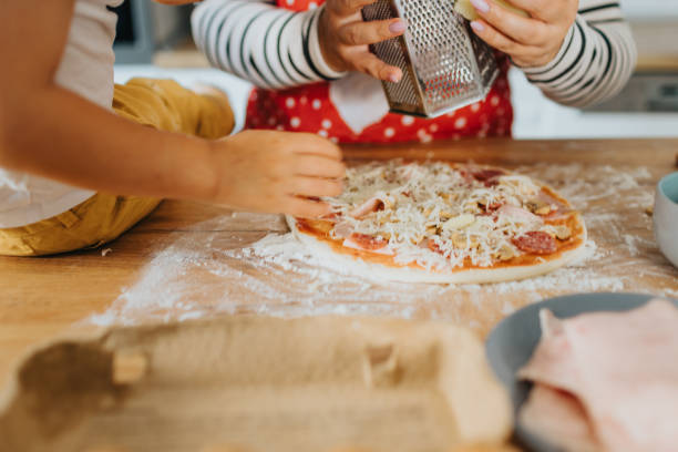 istock Happy family making dinner together 2155383962
