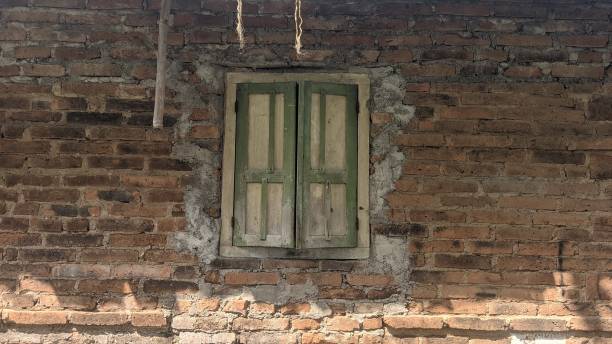 istock an old vintage wooden window on red brick wall 2155384222