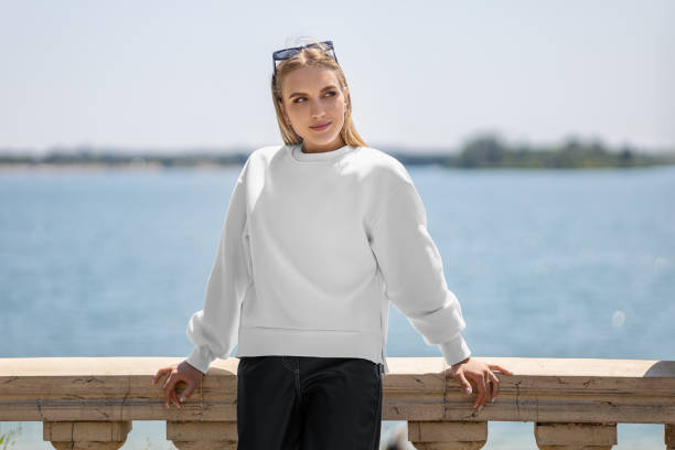 istock Mockup of a white sweatshirt on a girl in glasses, a pullover with slits on the sides, empty clothes. 2155384613
