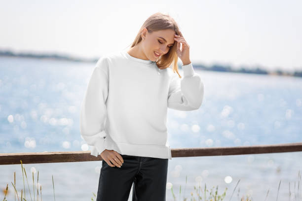 istock Mockup of white sweatshirt on blonde girl on background of river, quay, pullover front view. 2155384768