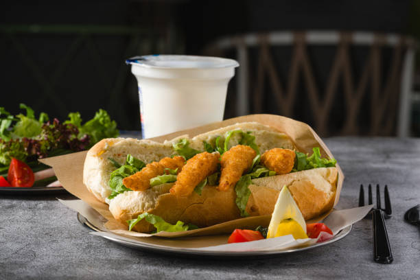 istock Deep fried shrimp in bread with greens on the side. Shrimp sandwich 2155385148