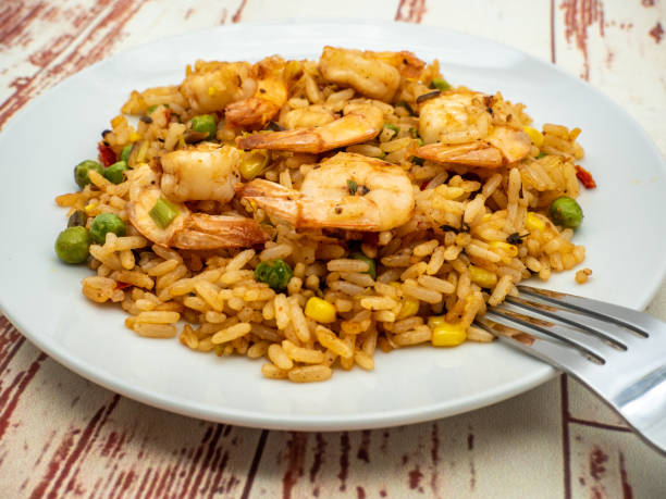 istock shrimp, stir fried rice and shrimps on plate 2155385855