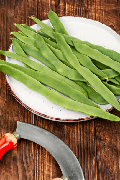 istock Fresh runner beans on wooden background. 2155385878