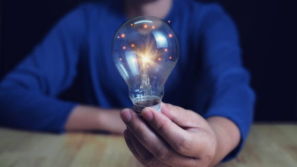 istock Innovation. Hands holding light bulb for Concept new idea concept with innovation and inspiration, innovative technology in science and communication concept. 2155390087