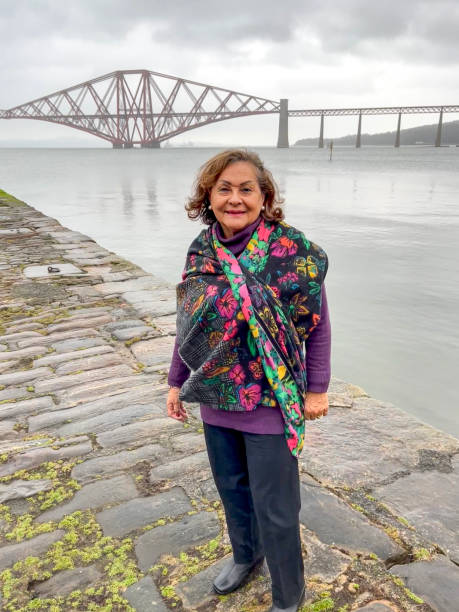 istock Senior Hispanic woman portrait at Forth Bridge Scotland 2155390101