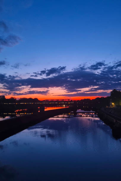 istock Stunning Sunset Over River with Dramatic Cloudscape and Reflections Perfect for Wall Art or Travel Posters 2155391490