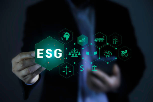 istock Businessman pointing to ESG icon. Net zero emission Idea innovation. Environmental, social,Governance. ESG icon around it. Green Energy Renewable Sustainable concept. carbon neutrality in 2050. 2155393582