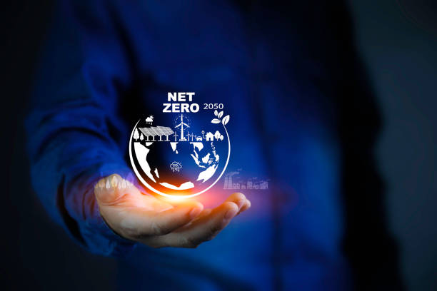 istock Net zero in 2050 , Reduce emissions, carbon neutral and ESG concept. net zero greenhouse gas emissions target Climate neutral. Human hand holding eco green energy system. 2155394266