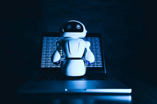 istock Artificial Intelligence digital concept. Robot in front of laptop. 2155395109
