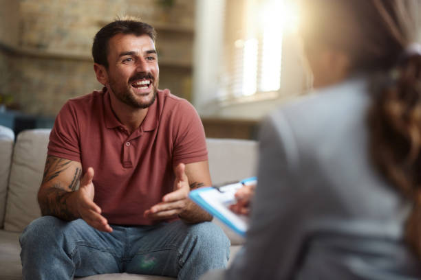 istock Happy man talking to his advisor at home. 2155395406