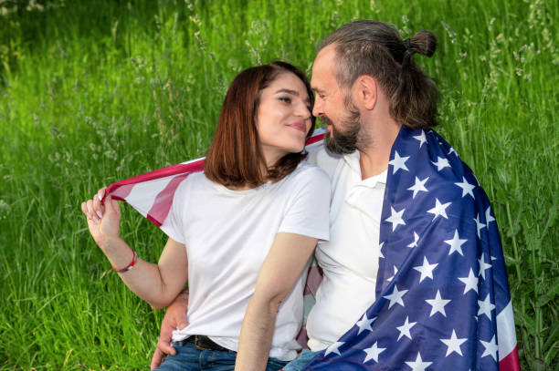 istock Couple with american flag. USA Independence Day Celebration 2155395894