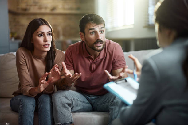 istock Displeased couple having a counseling session with therapist. 2155396040
